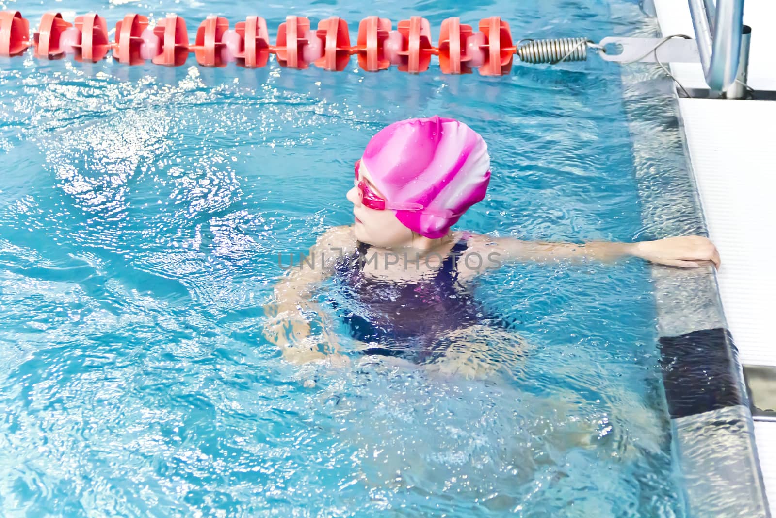 Photo of cute girl in swimming pool