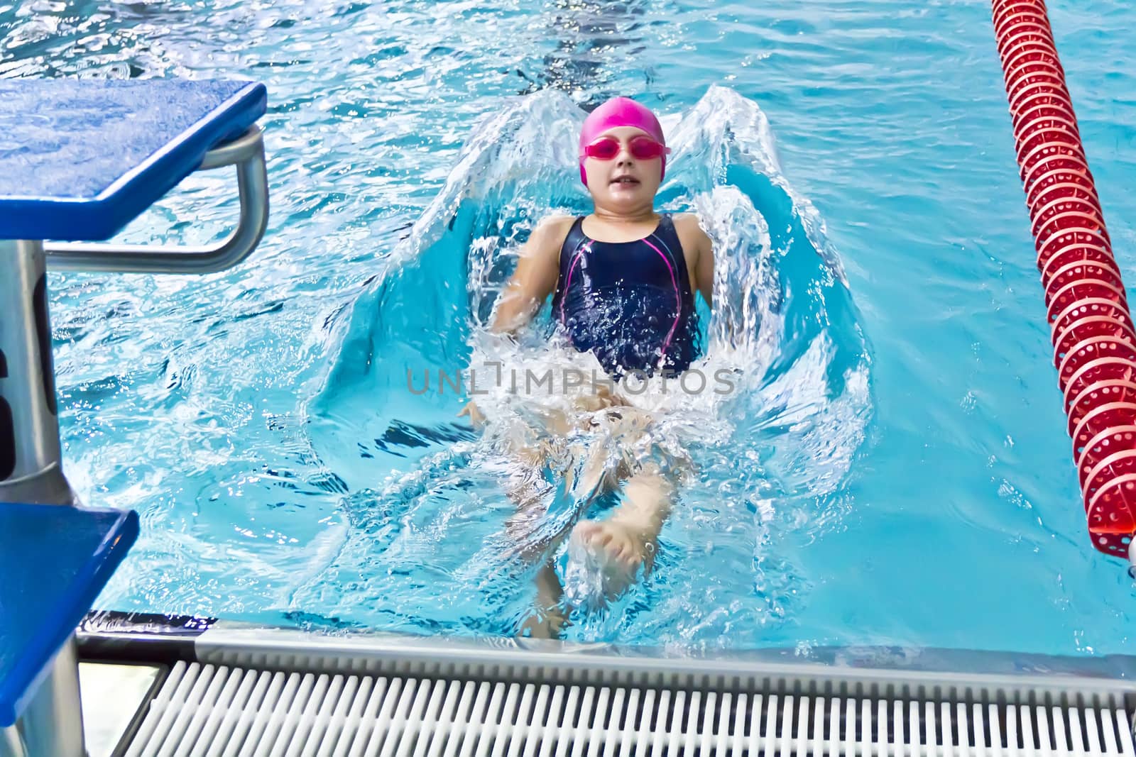 Photo of cute girl in swimming pool