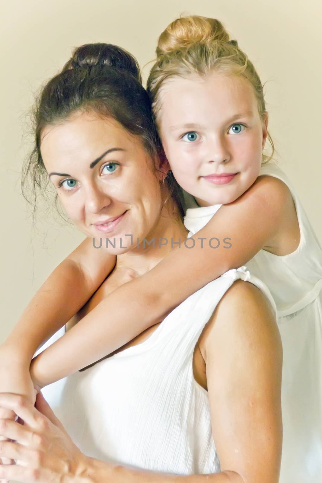 Photo of mother and daughter in white