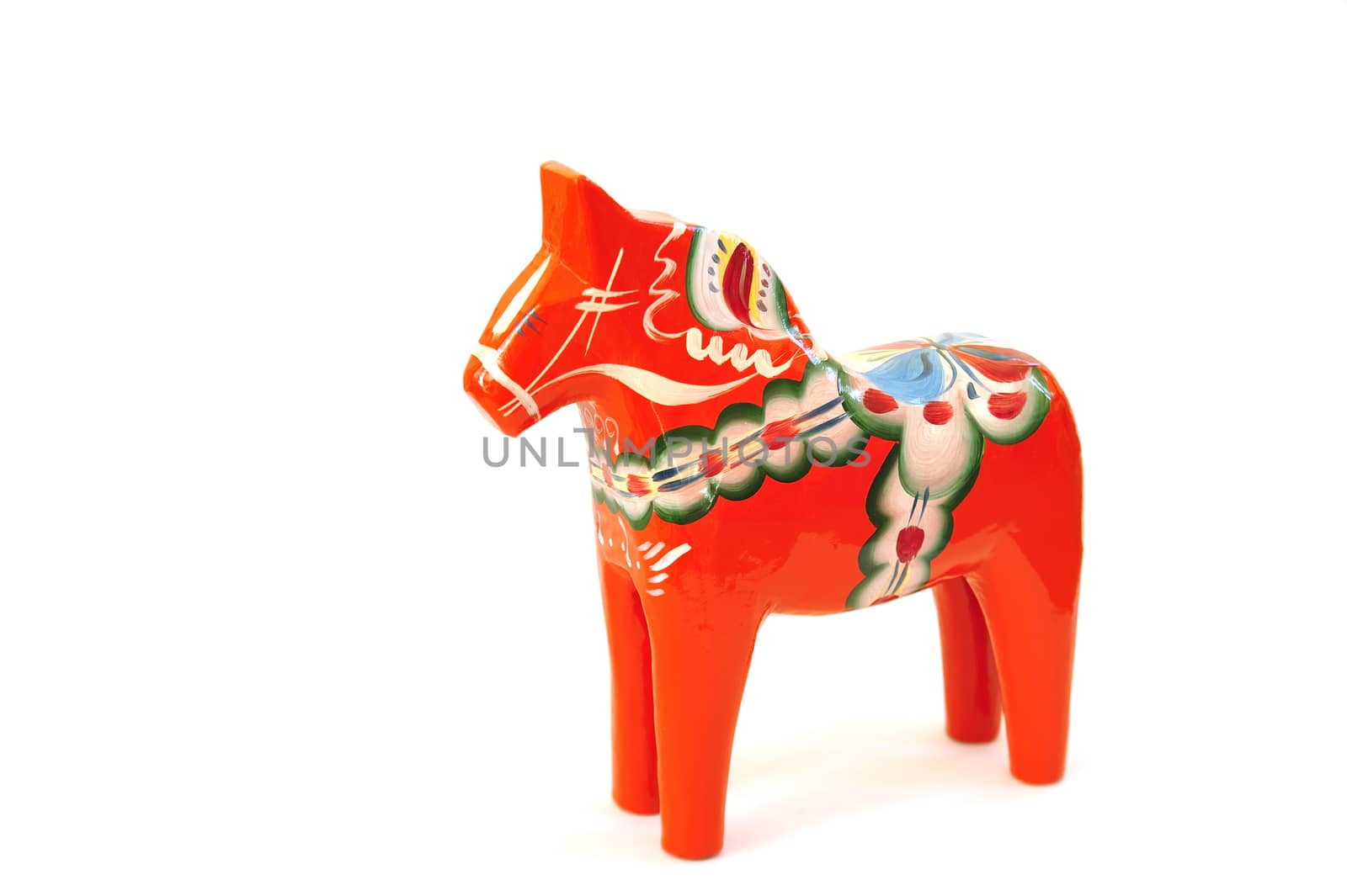 Swedish dalahorse (dalahäst) from Nusnäs in Dalarna. Made from pine and hand painted in traditional pattern. Isolated on pure white. Clipping path included.