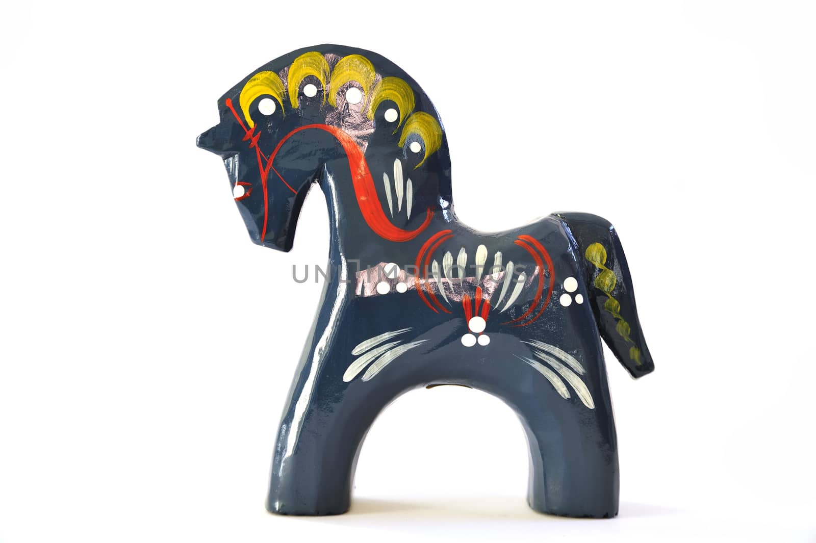 Swedish dalahorse (dalahäst) from Nusnäs in Dalarna. Made from pine and hand painted in traditional pattern. Isolated on pure white. Clipping path included.