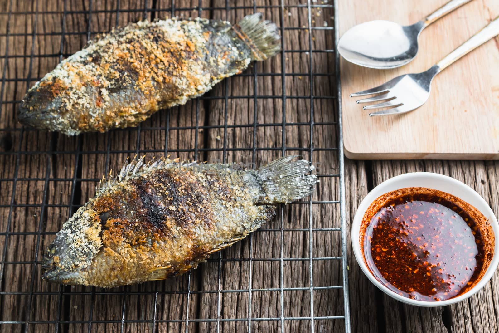 Fresh "Climbing perch" or "Climbing gourami" grilled with salt, Traditional Thai food