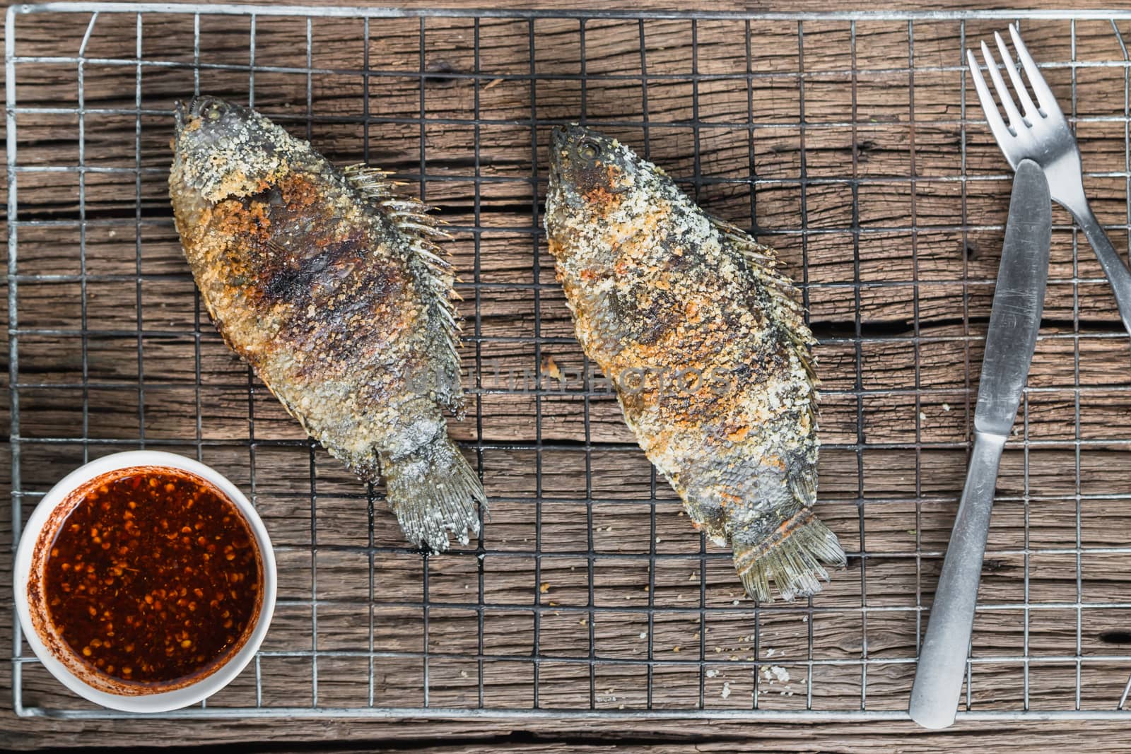 Fresh "Climbing perch" or "Climbing gourami" grilled with salt, Traditional Thai food