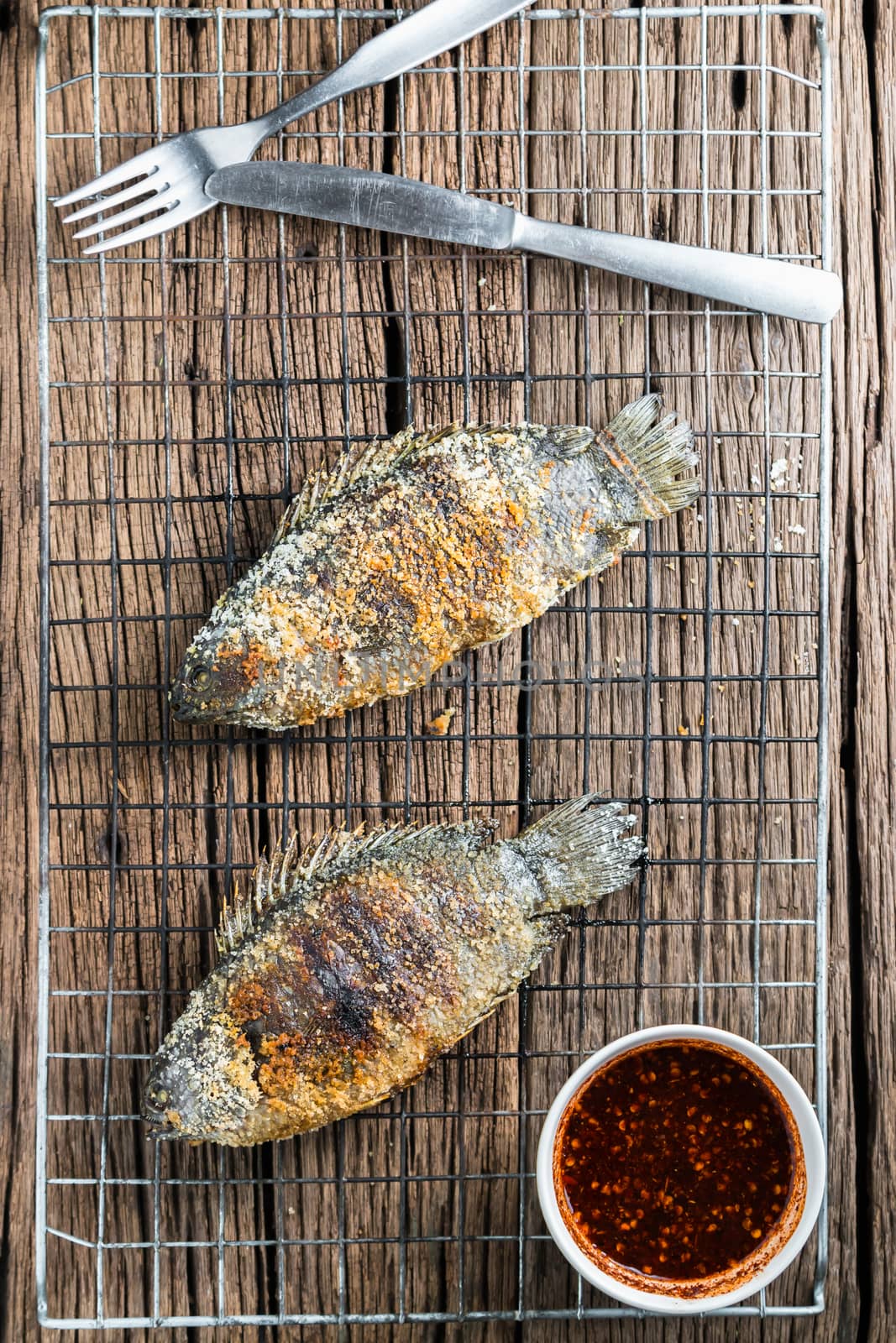 Fresh "Climbing perch" or "Climbing gourami" grilled with salt, Traditional Thai food