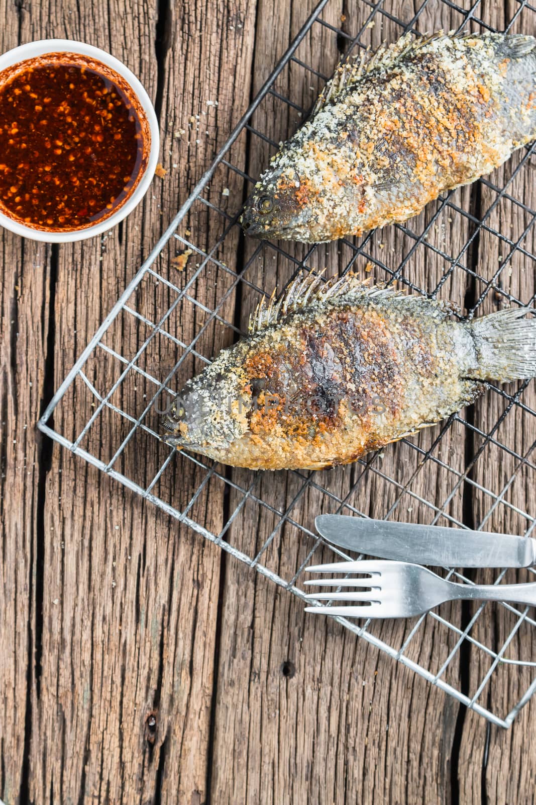 Fresh "Climbing perch" or "Climbing gourami" grilled with salt, Traditional Thai food