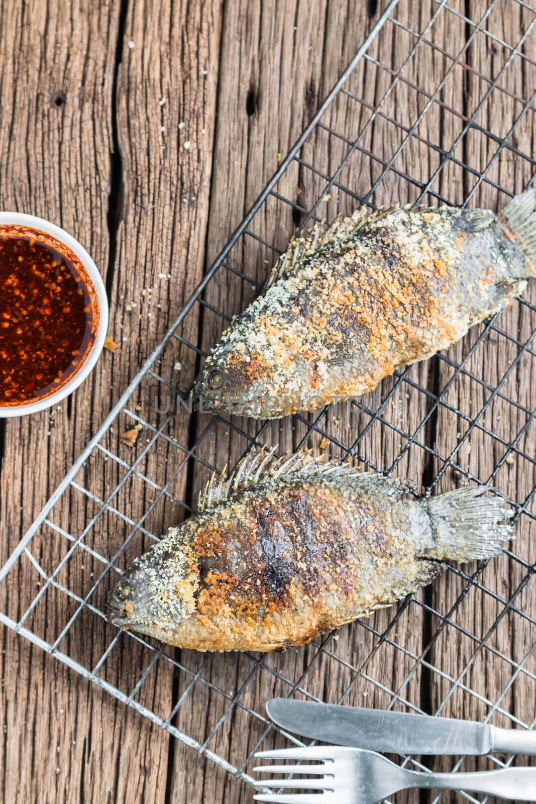 Fresh "Climbing perch" or "Climbing gourami" grilled with salt, Traditional Thai food