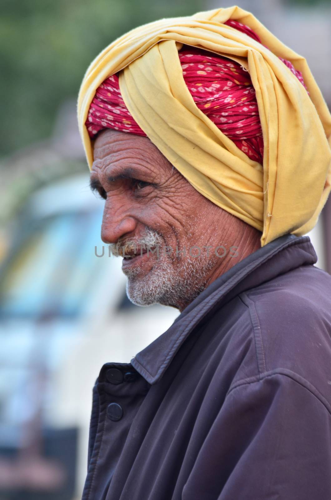 Jodhpur, India - January 2, 2015: Unidentified Indian senior man in the Jodhpur village on January 2, 2015 in Jodhpur, India. Jodhpur is know as the blue city.