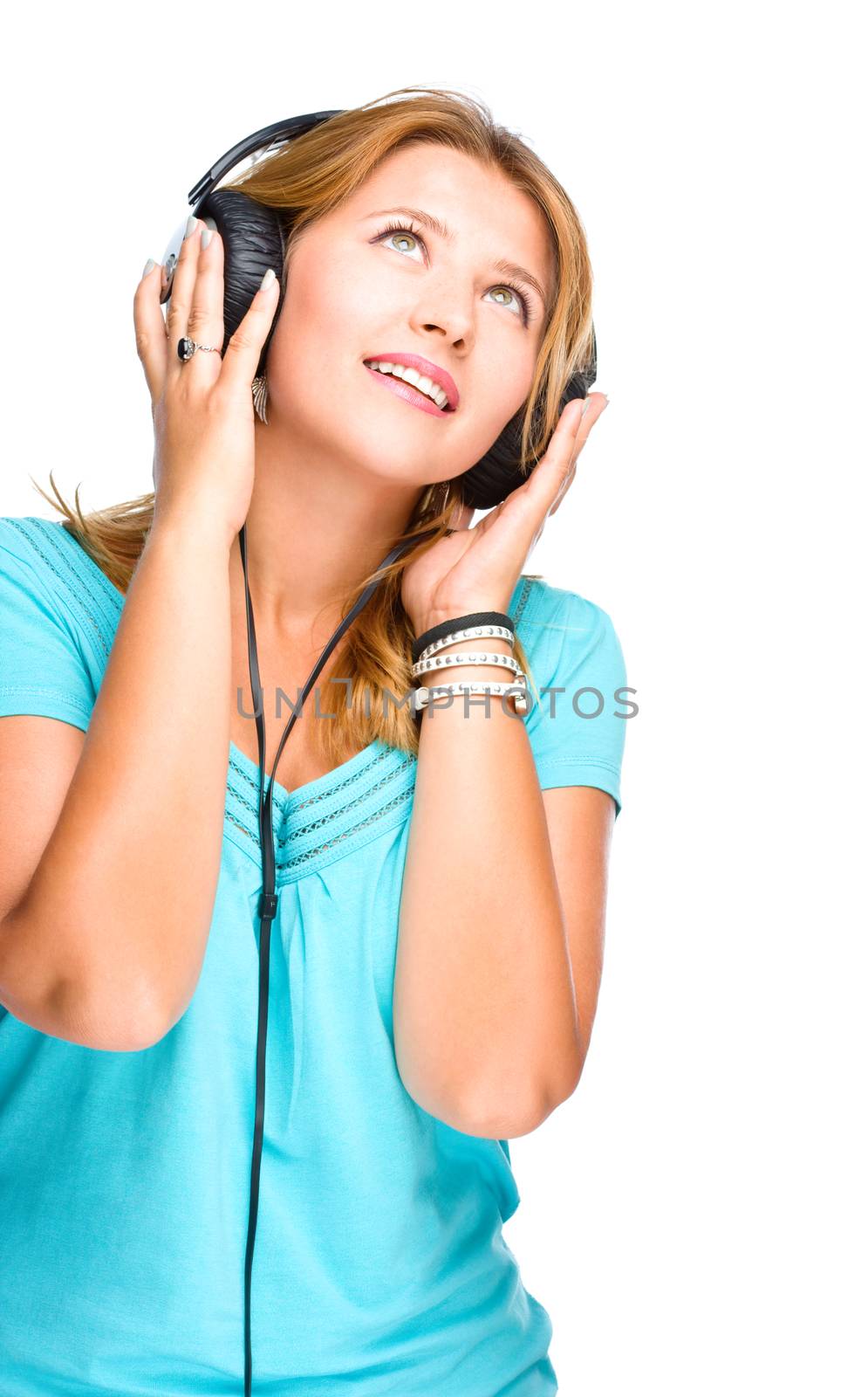 Beautiful girl with headphones isolated on a white background
