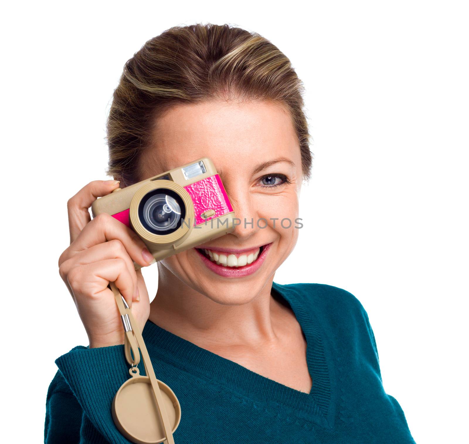 Happy woman holding pink camera isolated on white background