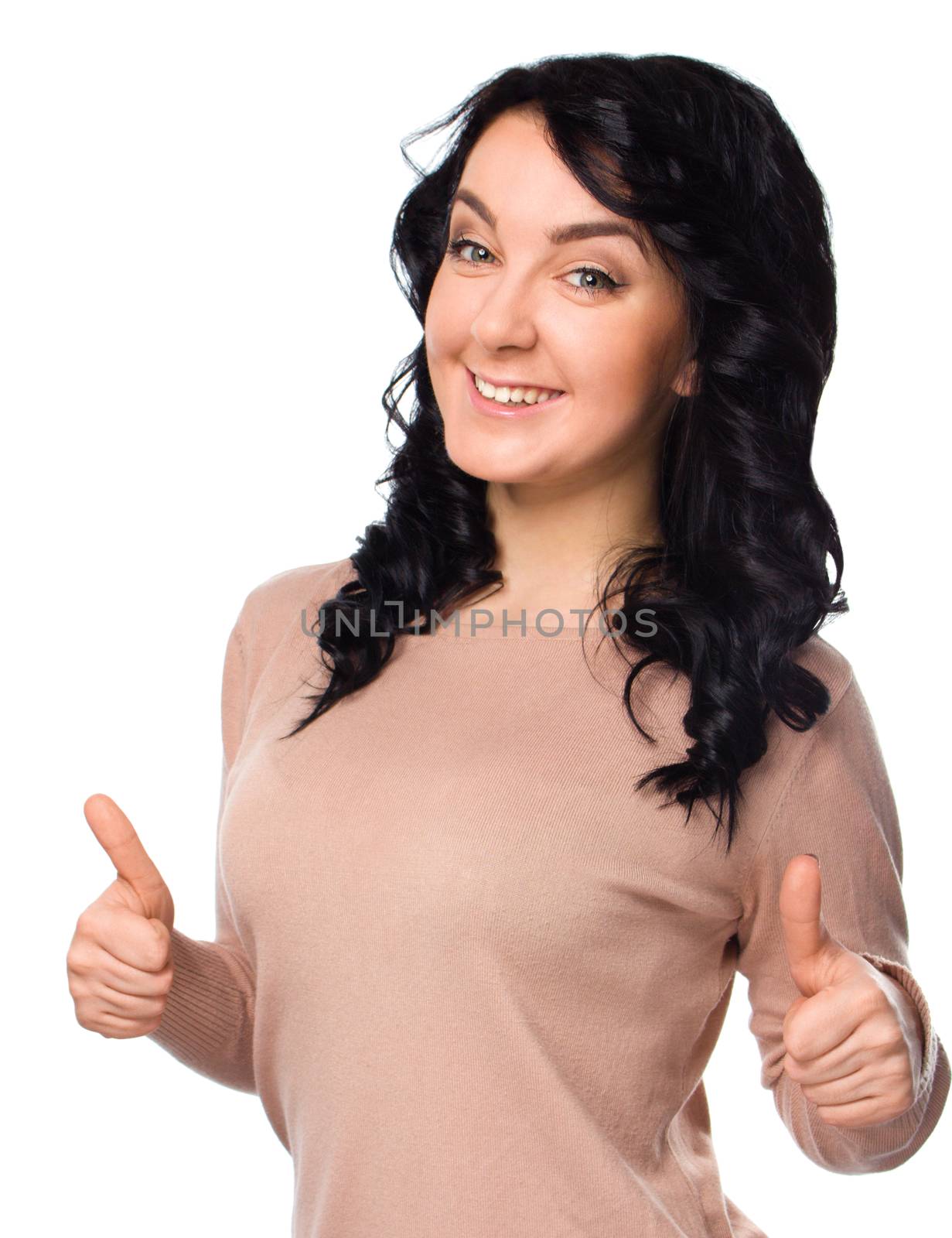 Young woman is showing thumb up gesture, isolated over white