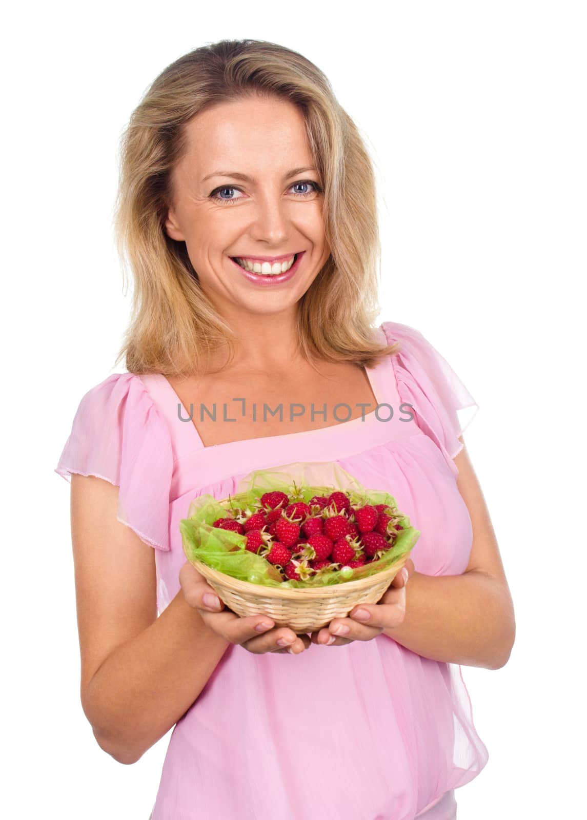 Close up of smiling woman holding raspberries isolated on white