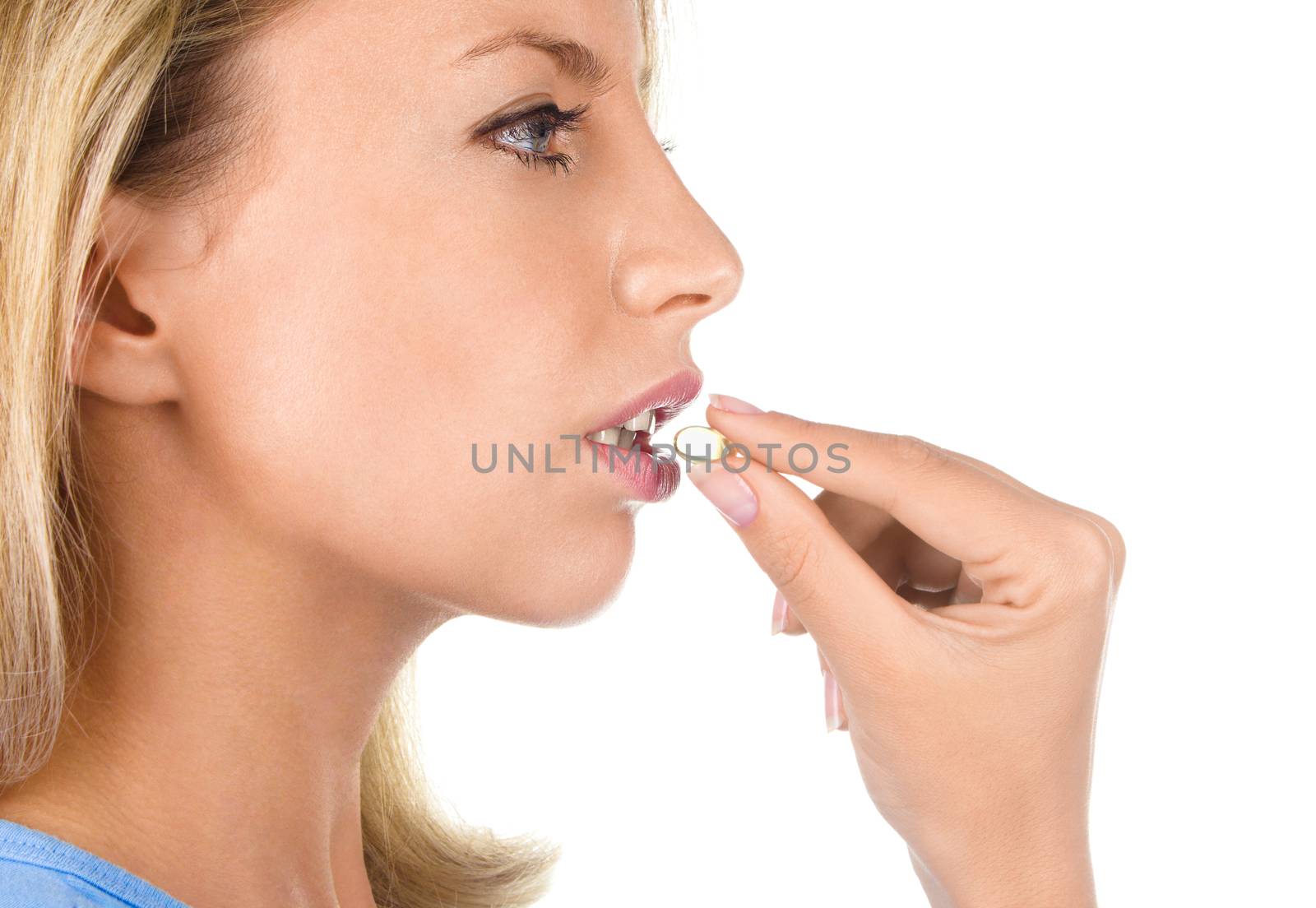 Portrait of woman with Omega 3 fish oil capsule, isolated on white background