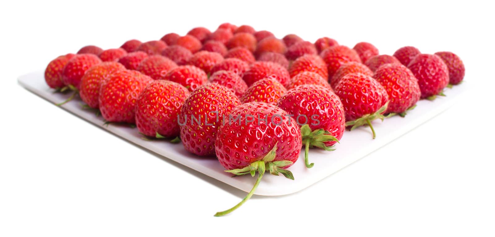 Fresh strawberries close up shoot on white surface by id7100