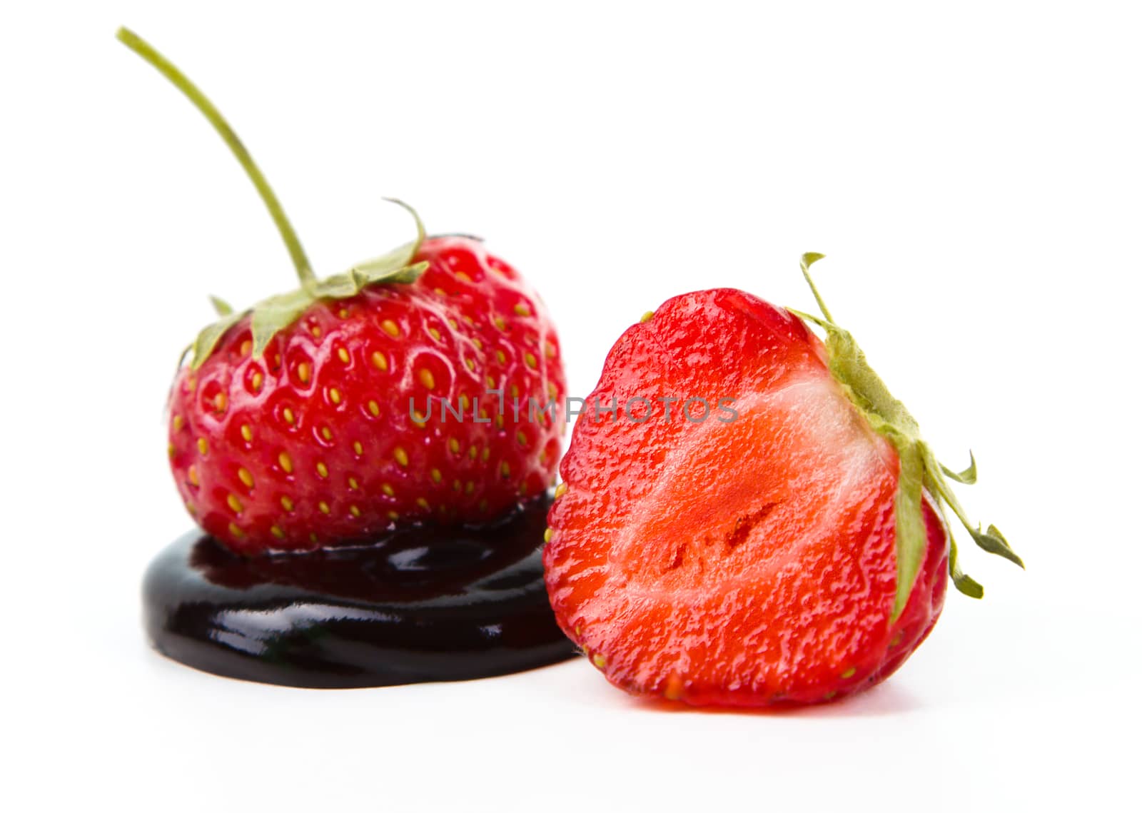 Strawberries and chocolate isolated on a white background