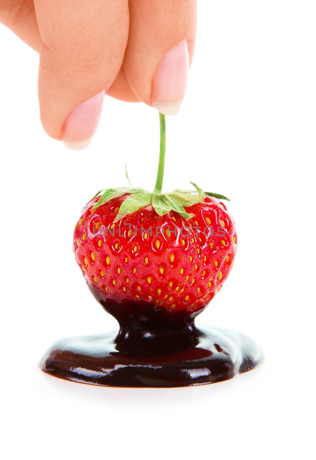 Woman hand holding chocolate-dipped strawberry by id7100