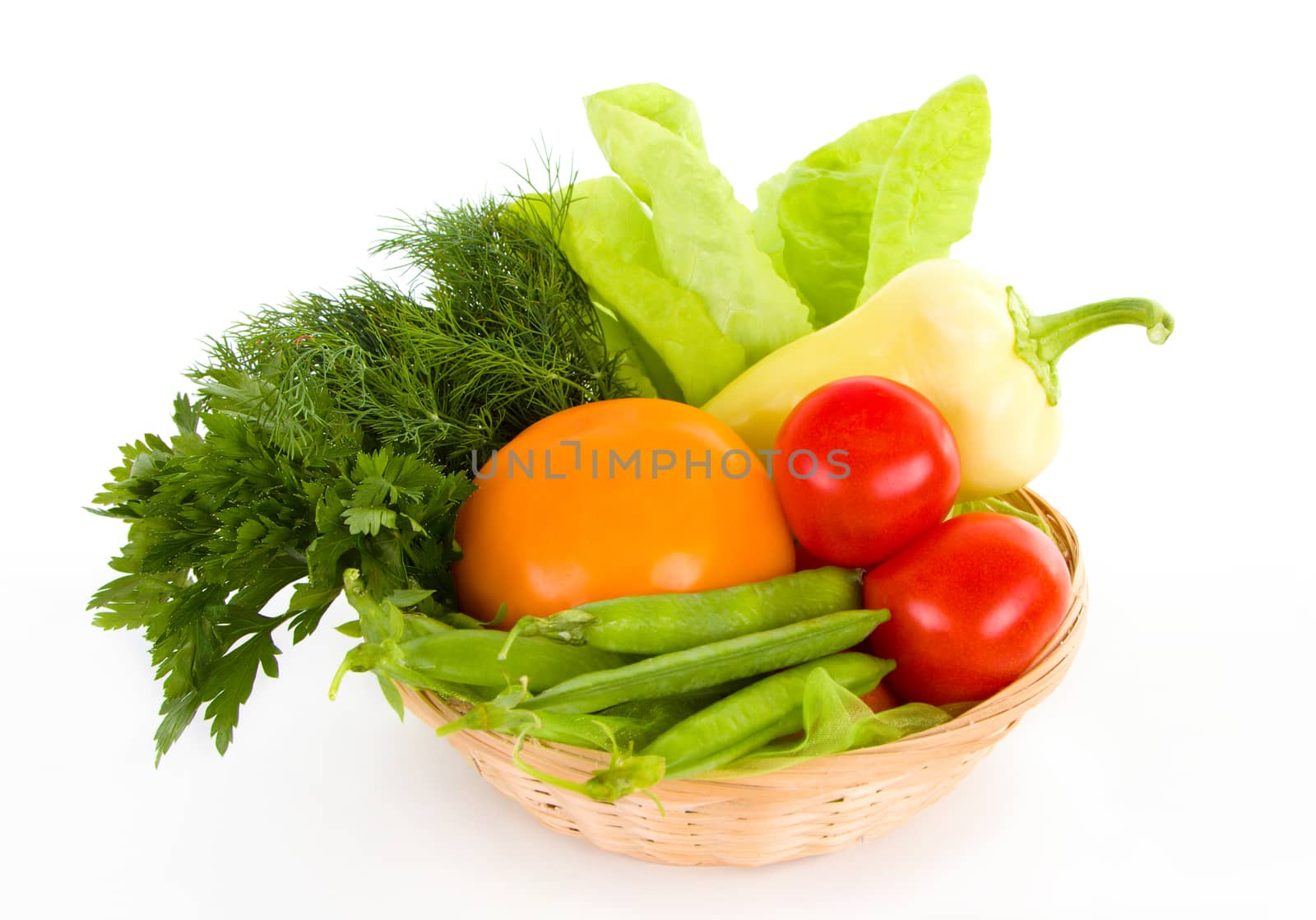 Fresh vegetables in the basket isolated on white background