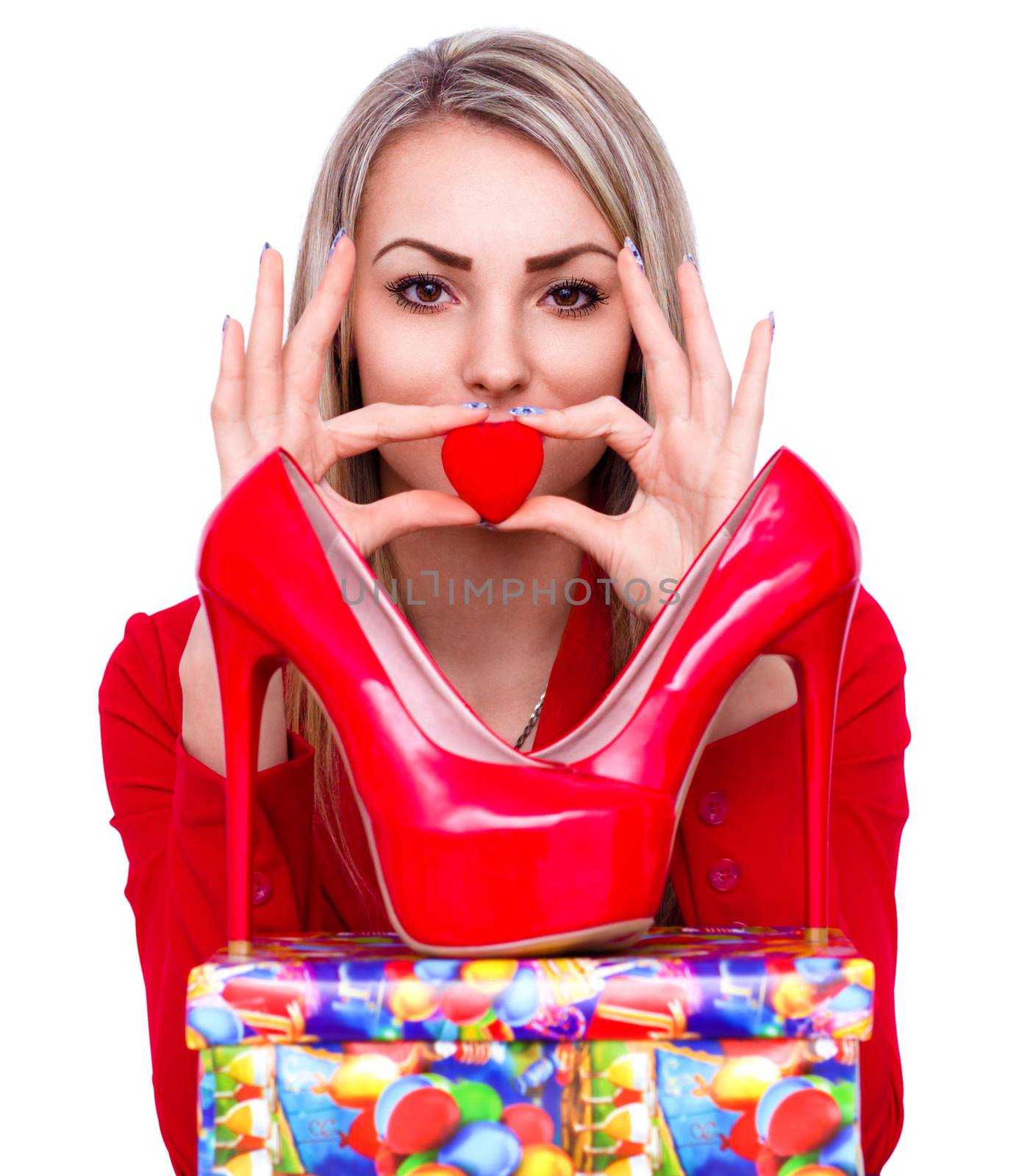 Young beautiful woman happy to receive red high heels shoes as a present
 by id7100