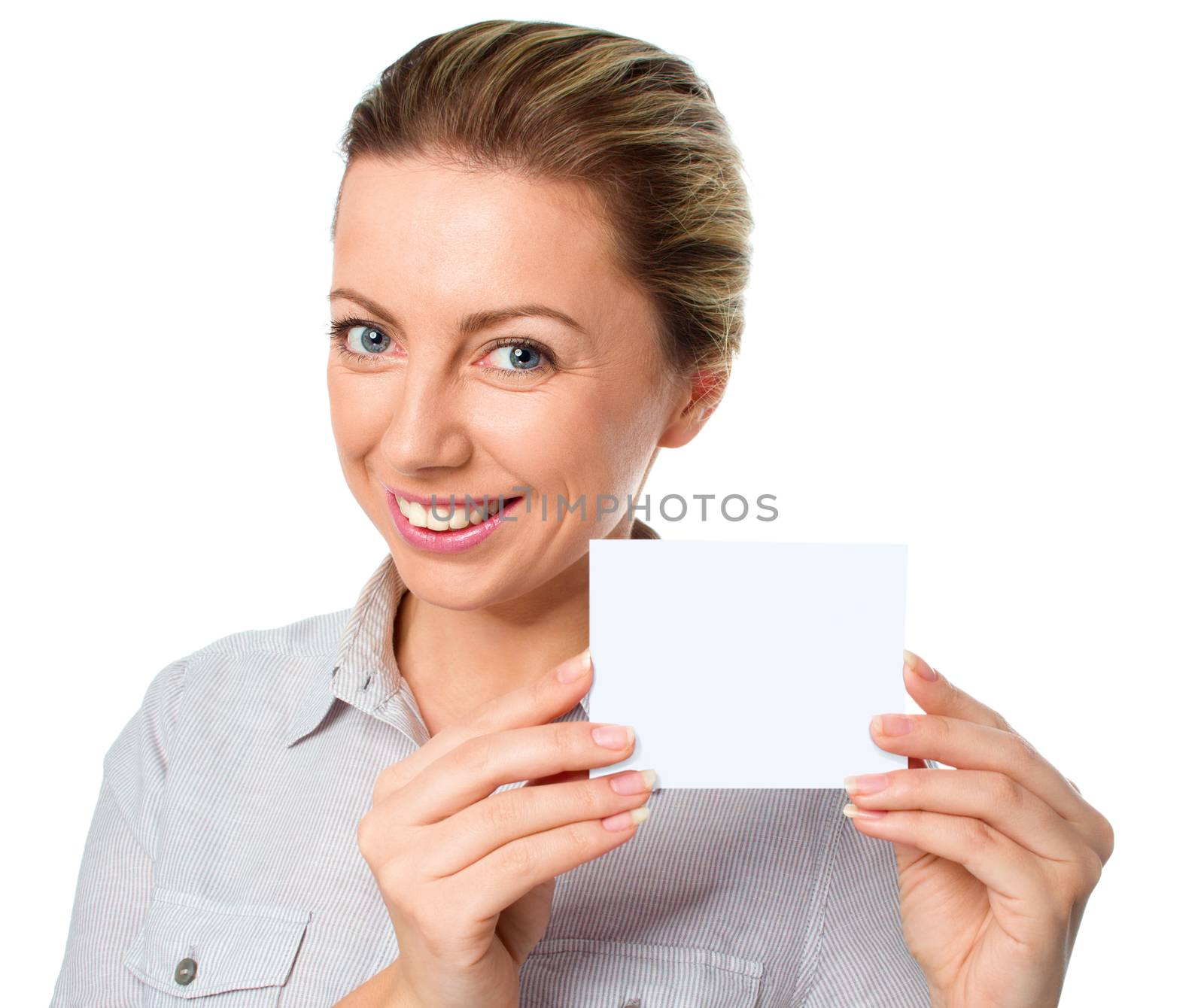 Attractive young woman showing empty blank paper card sign with copy space for text, isolated over white