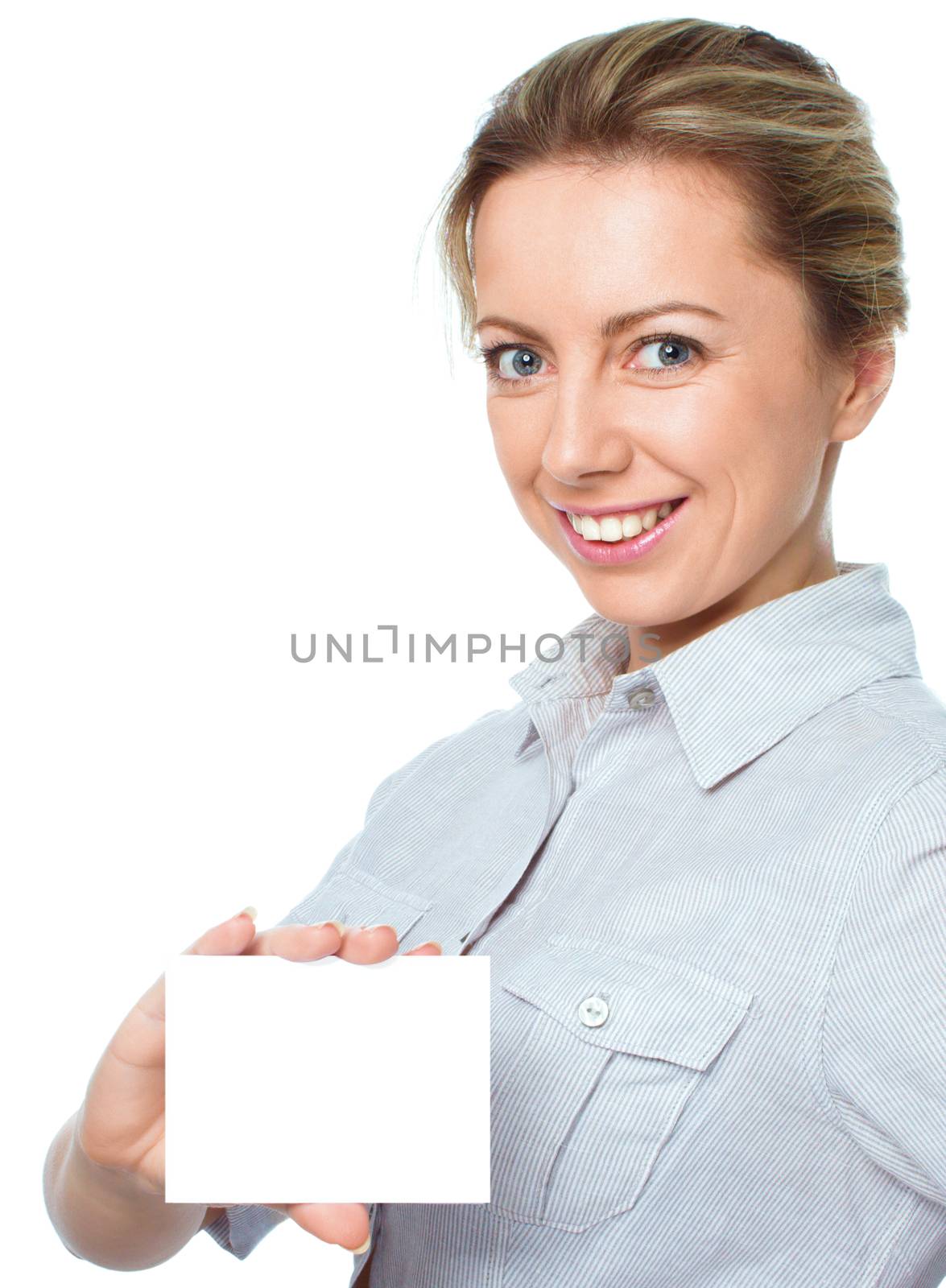 Attractive young woman showing empty blank paper card sign with copy space for text, isolated over white