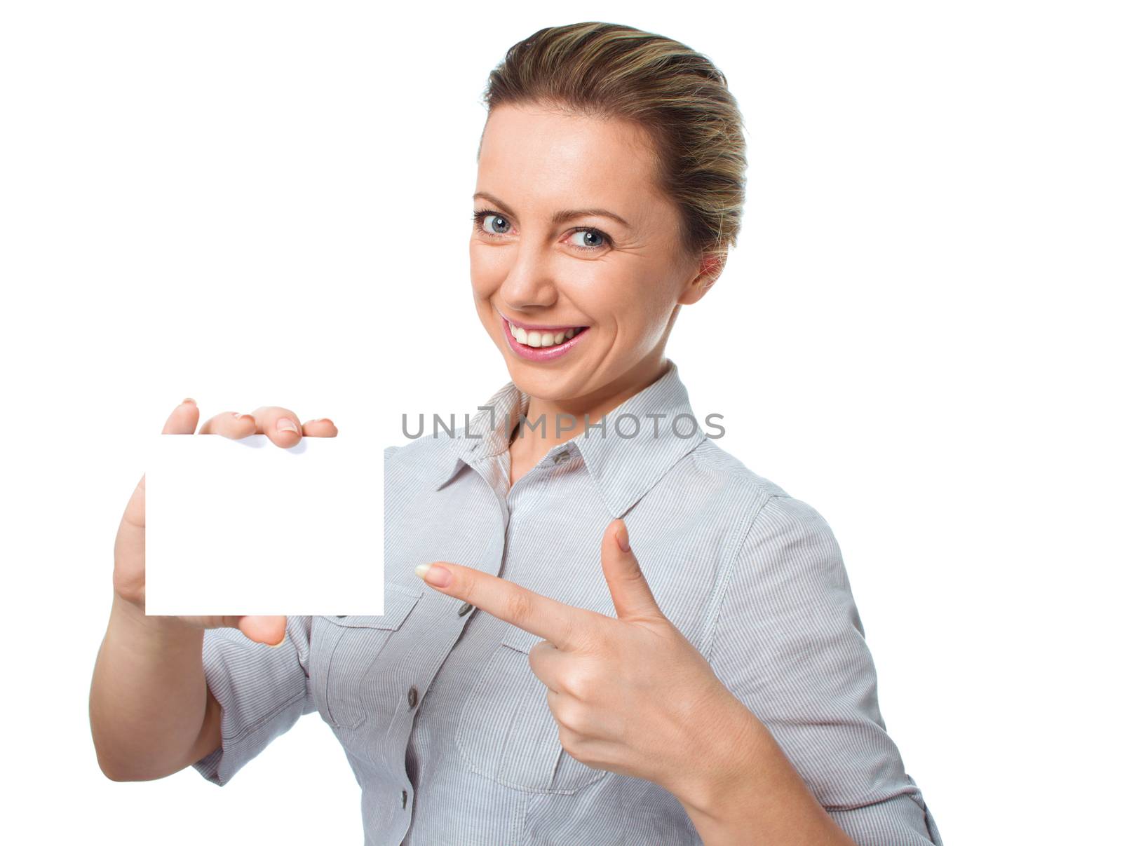 Attractive young woman showing empty blank paper card sign with copy space for text, isolated over white