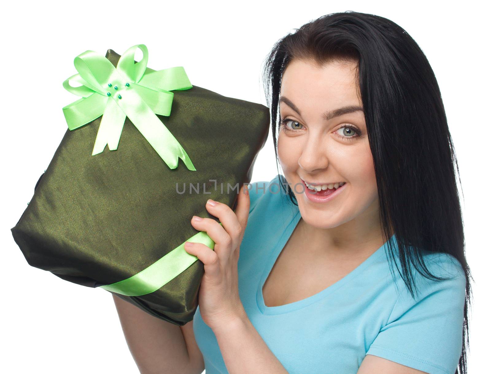 Woman holding gift box isolated on white background
