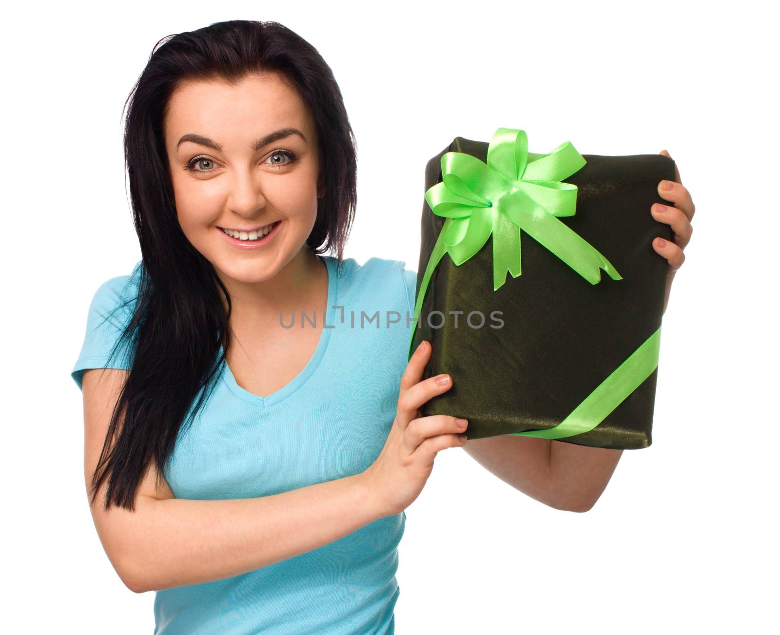 Woman holding gift box isolated on white background