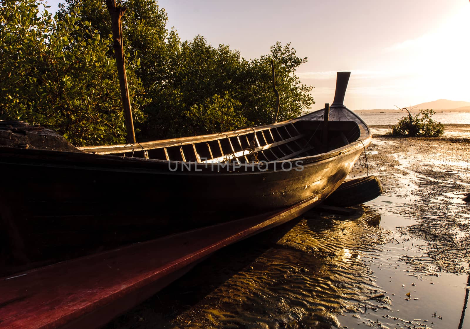 Fishing boat with color of sunset by jimbophoto