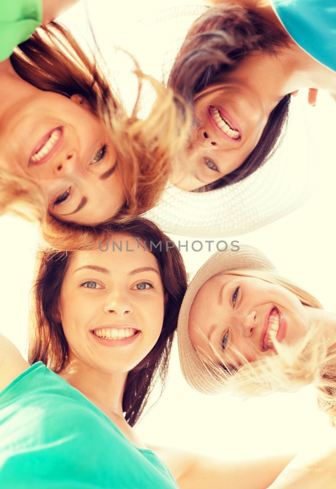 faces of girls looking down and smiling by dolgachov
