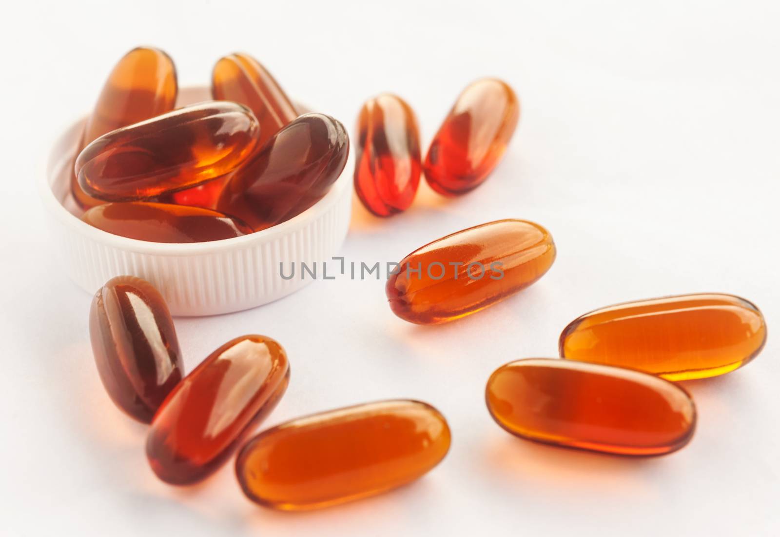 Vitamin in capsule on white, Vitamin for health