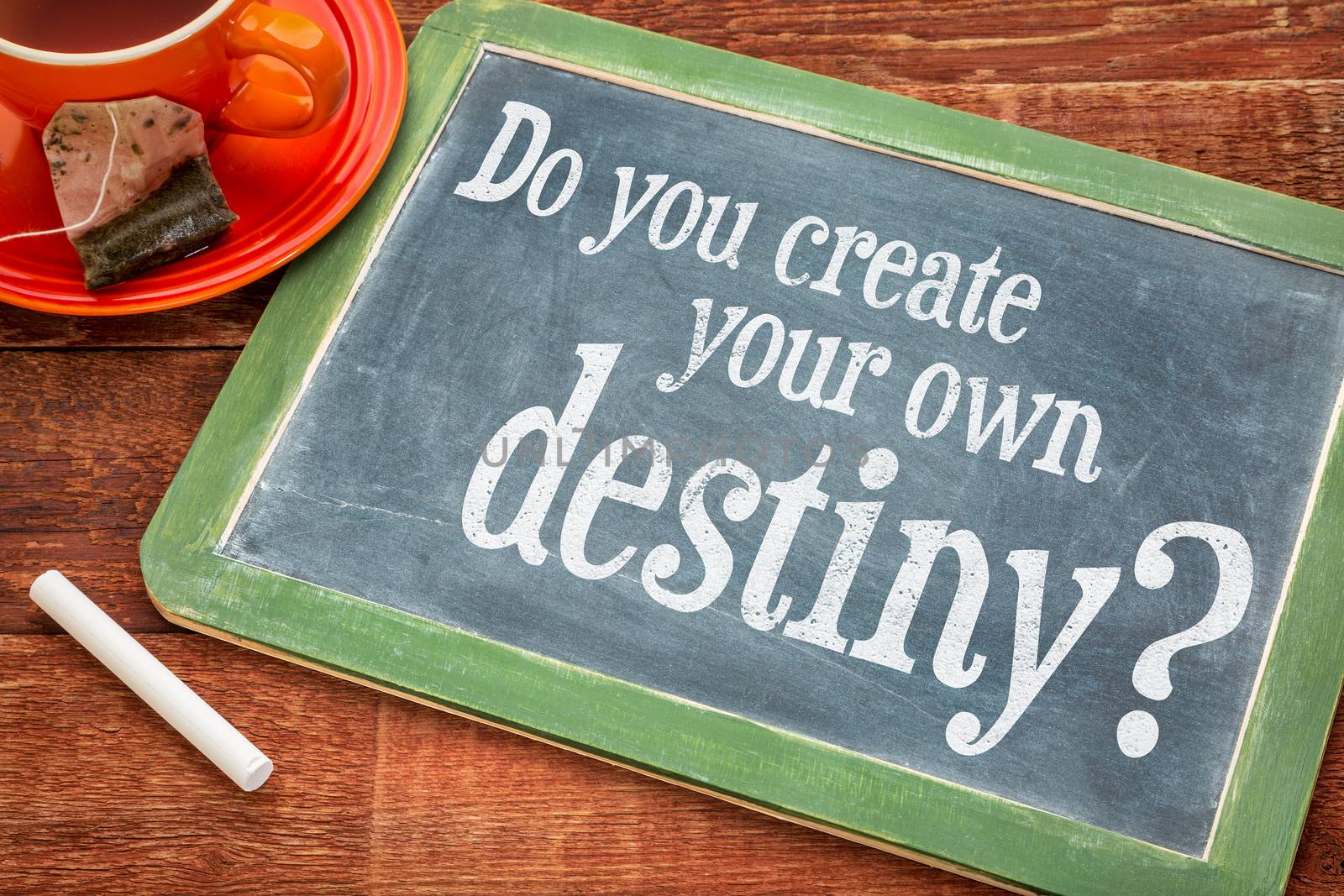 Do you create your own destiny question  on a slate blackboard with chalk and cup of tea