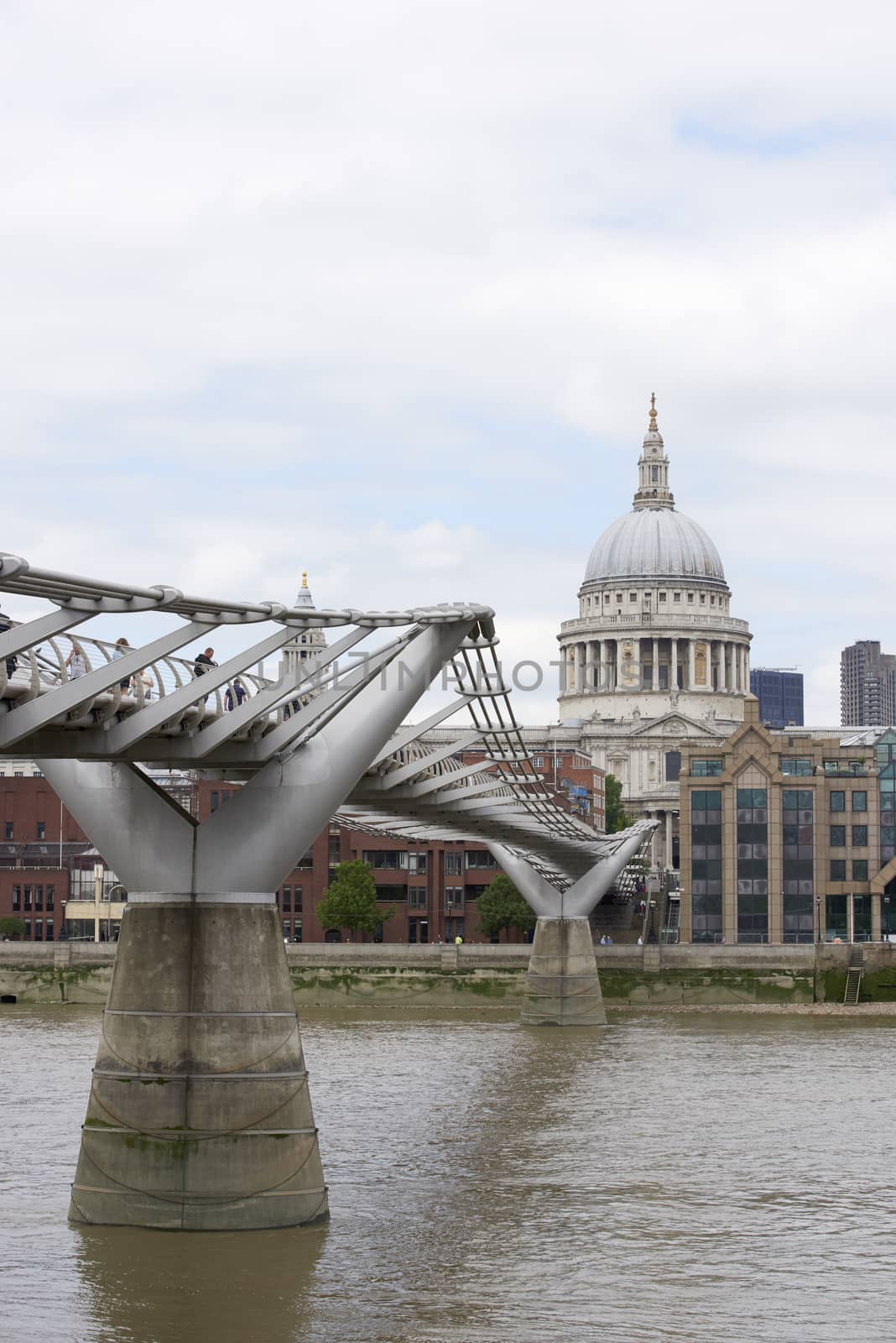 LONDON, UK - JUNE 23: Dome of Saint Paul's cathedral with Millennium Bridge in the foreground. June 23, 2015 in London.