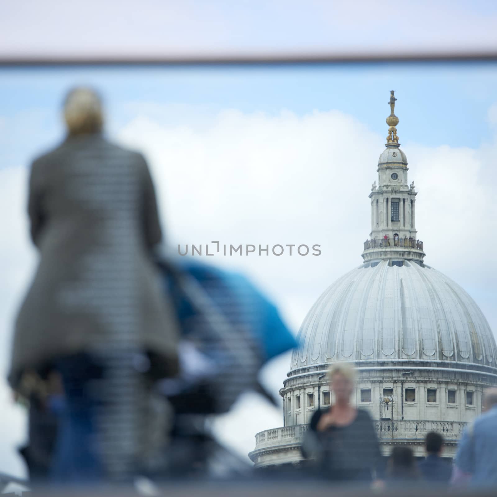 LONDON, UK - JUNE 23: Dome of Saint Paul's cathedral seen from Blackfriars, with blurred people in the foreground. June 23, 2015 in London.