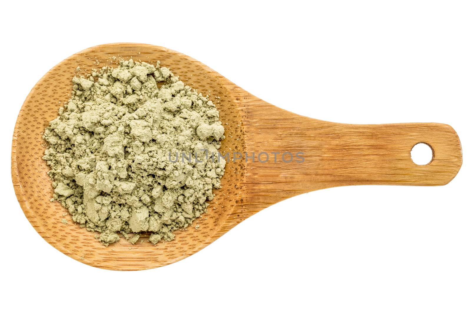 kelp seaweed powder - top view of a wooden spoon isolated on white