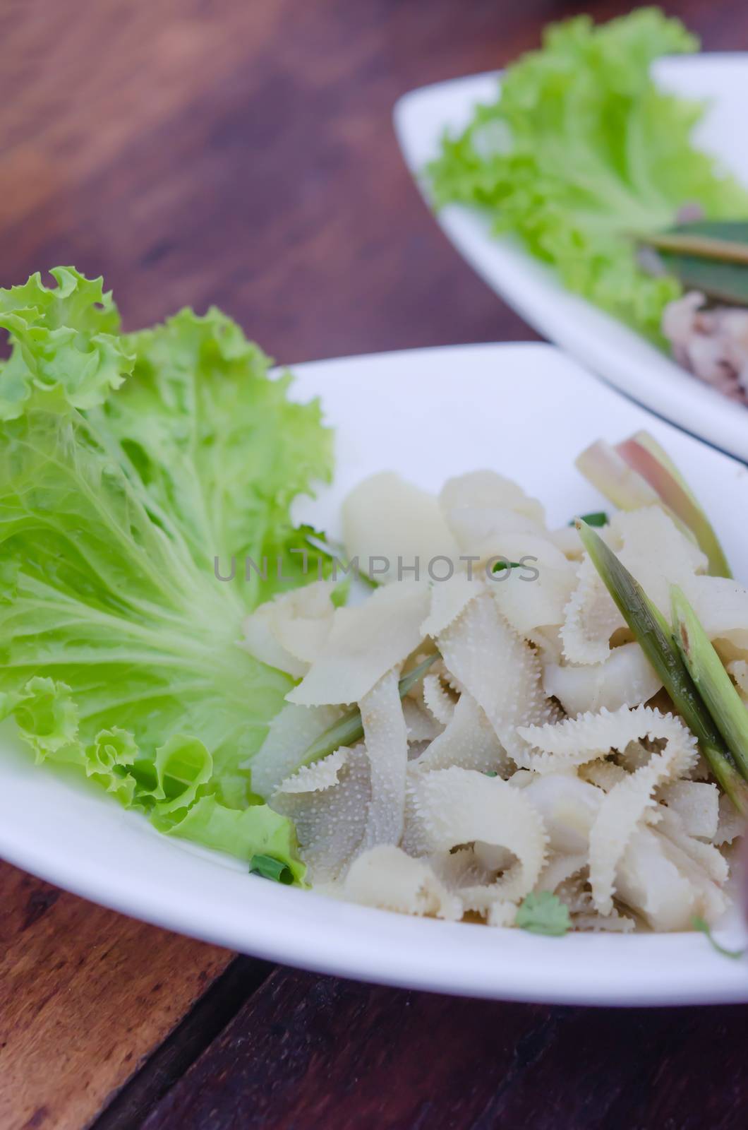 entrails of stomach of beef cooked served with fresh lettuce