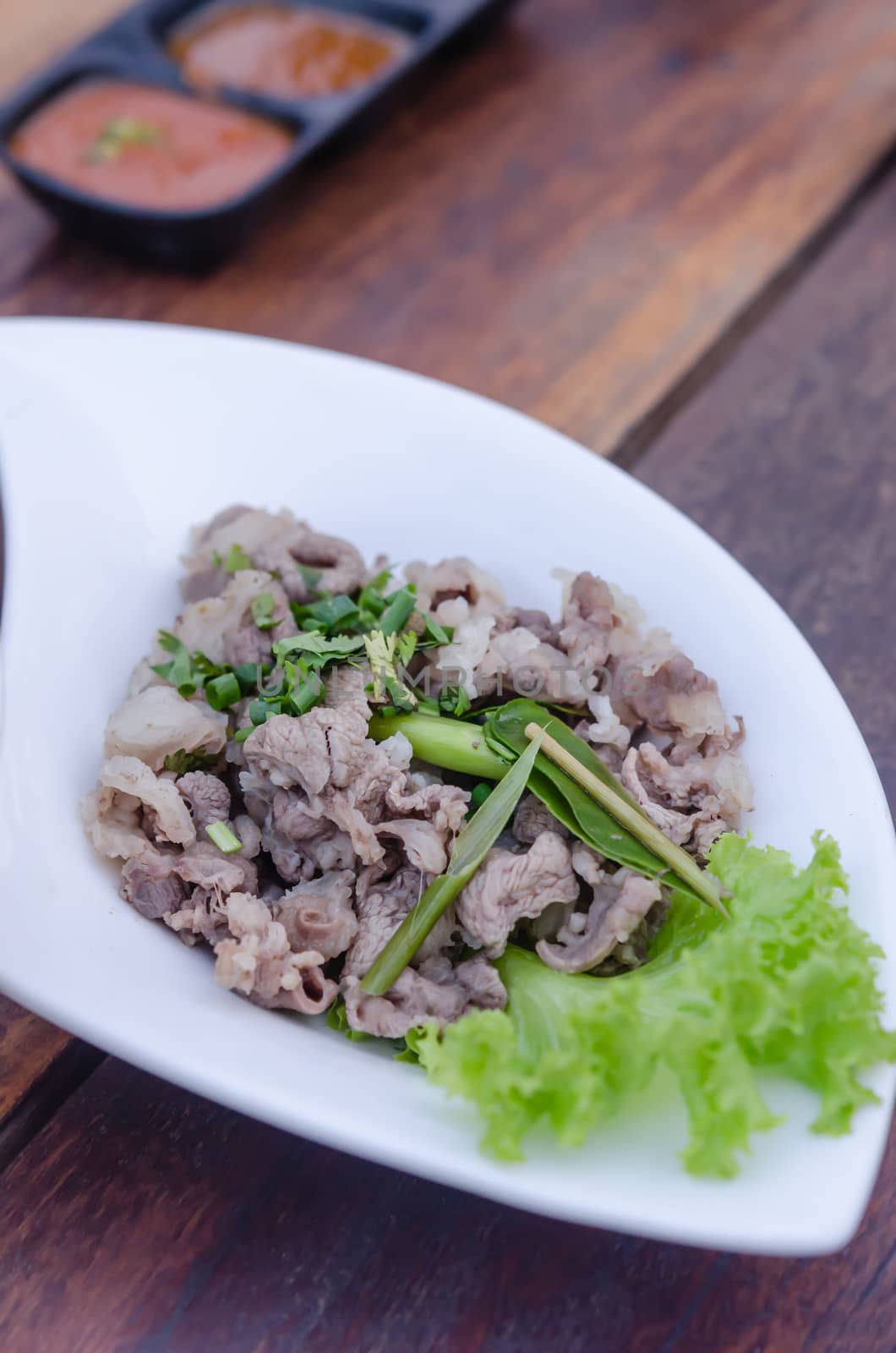 Blanched beef served with fresh green vegetable