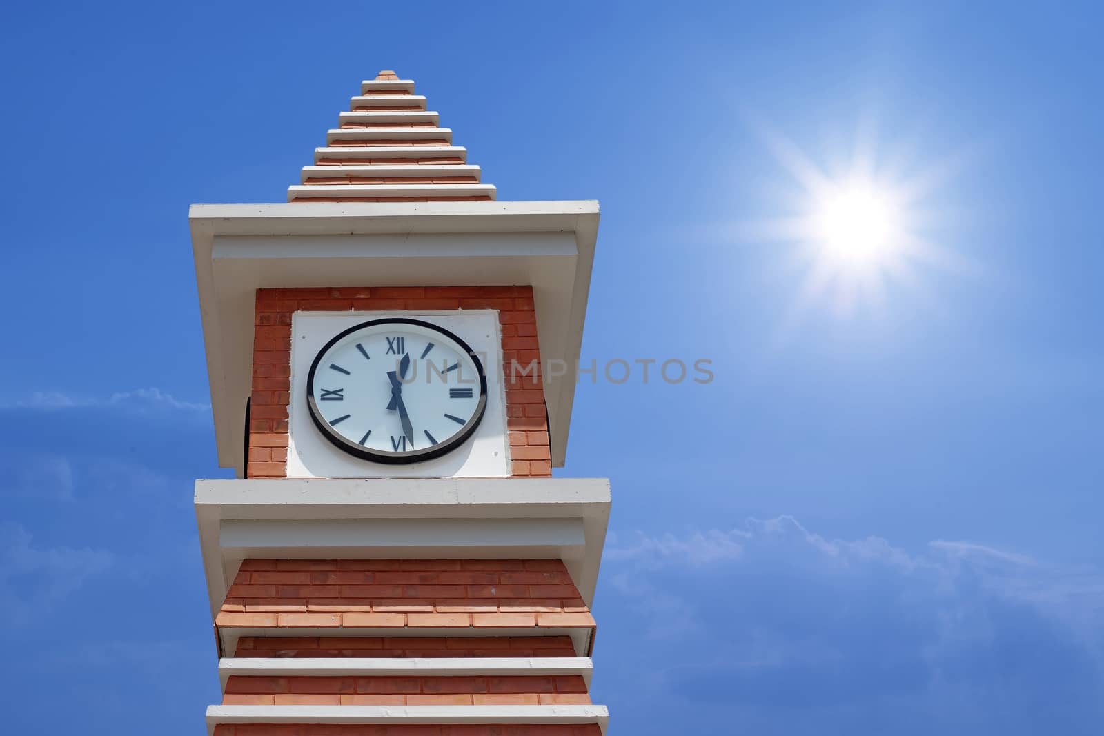 clock tower with beautiful sun and sky background