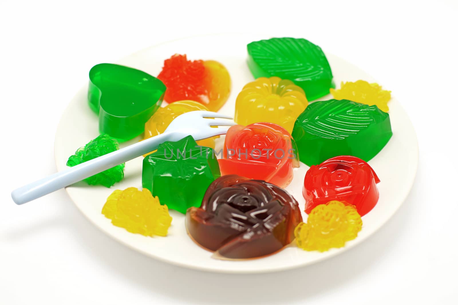 colorful gelatin or jelly dessert isolated on white background 