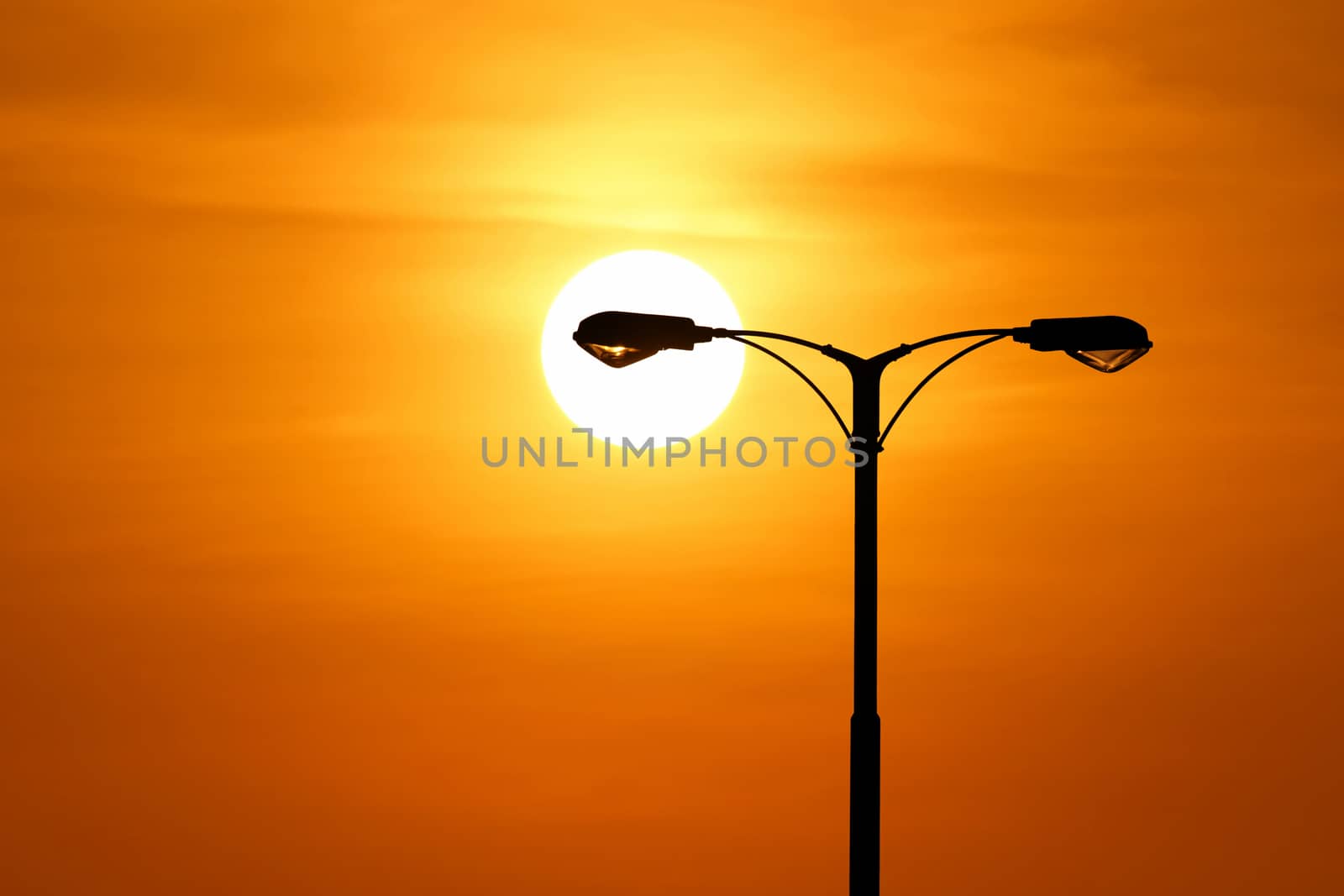 silhouette of streetlight with beautiful sunset background