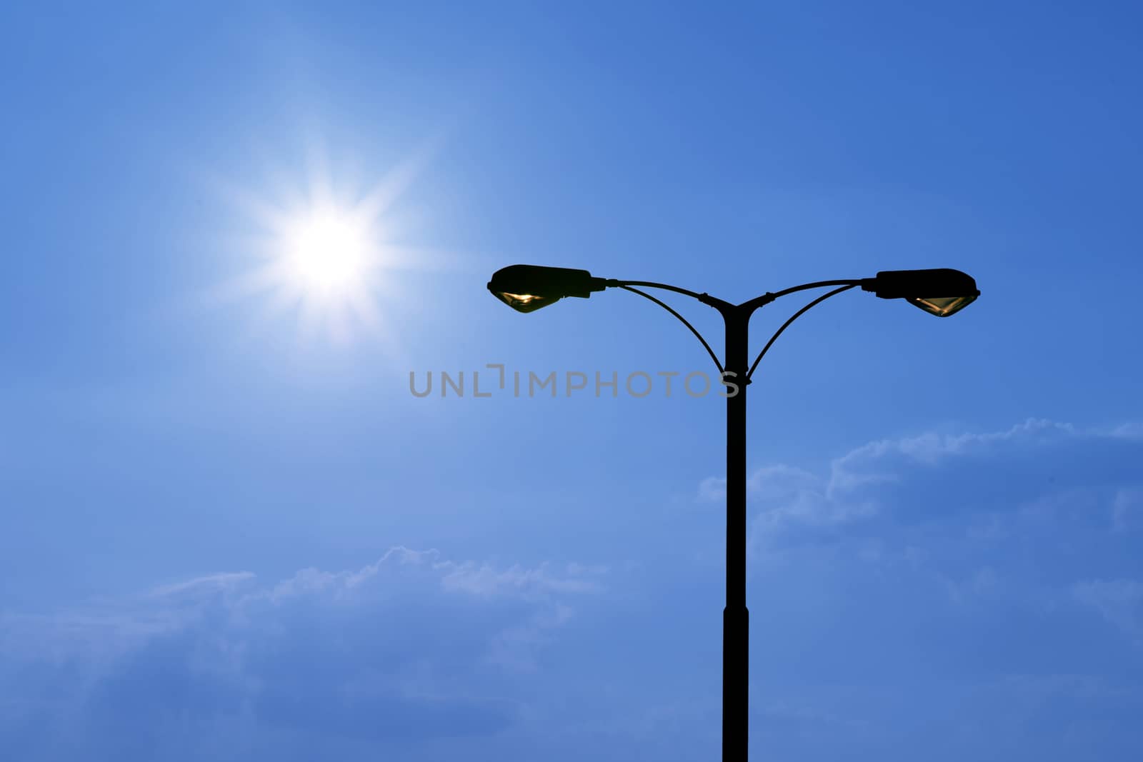 silhouette of streetlight with beautiful sunlight background