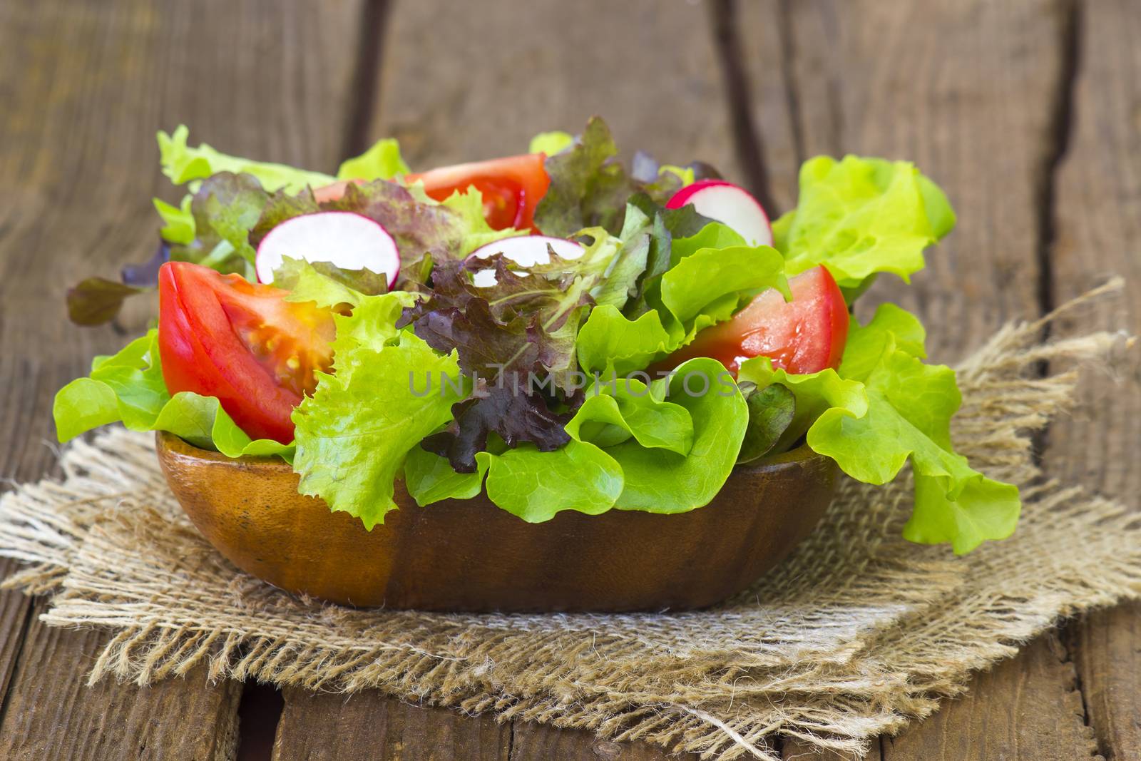 fresh salad in a bowl by miradrozdowski