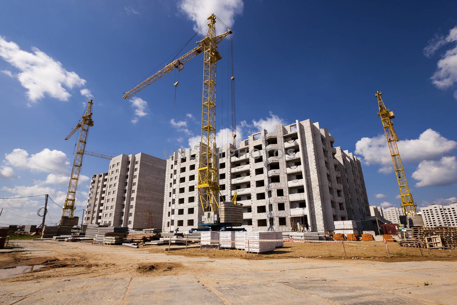  a construction site on which construction of a new multystoried house is carried out.