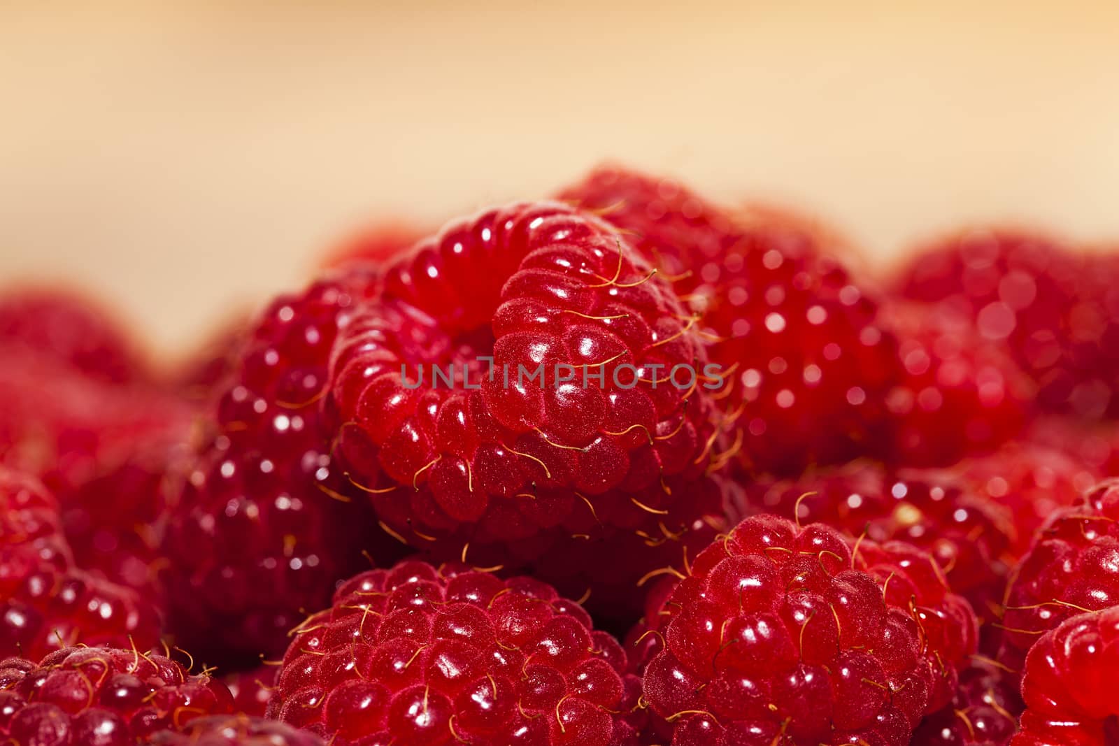   the gathered and piled raspberry. small depth of sharpness