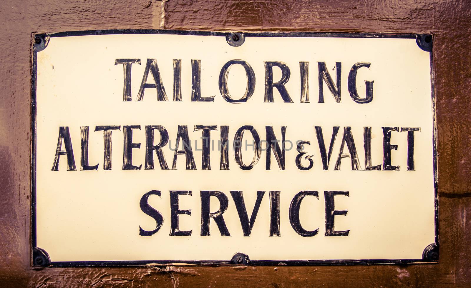 A Vintage Sign For A Tailor And Valet In London England