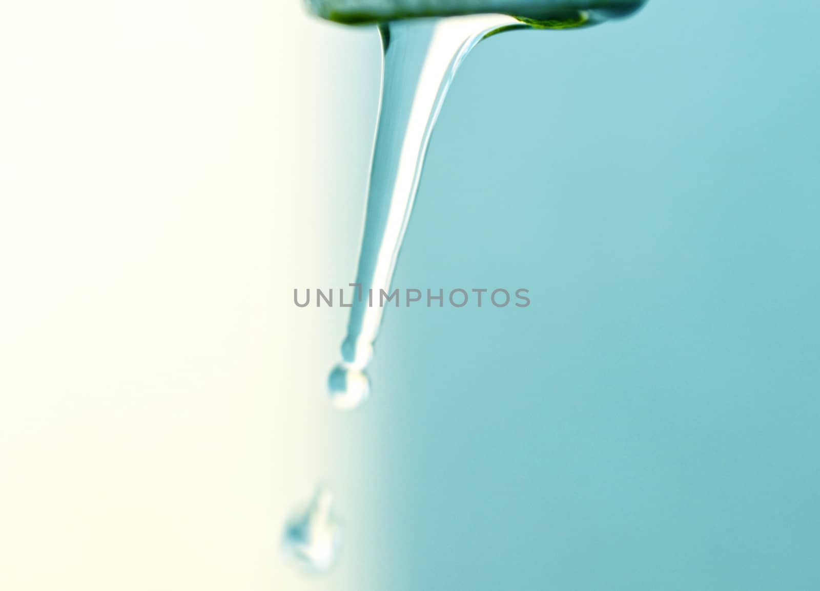 Tap of running water  on grey background