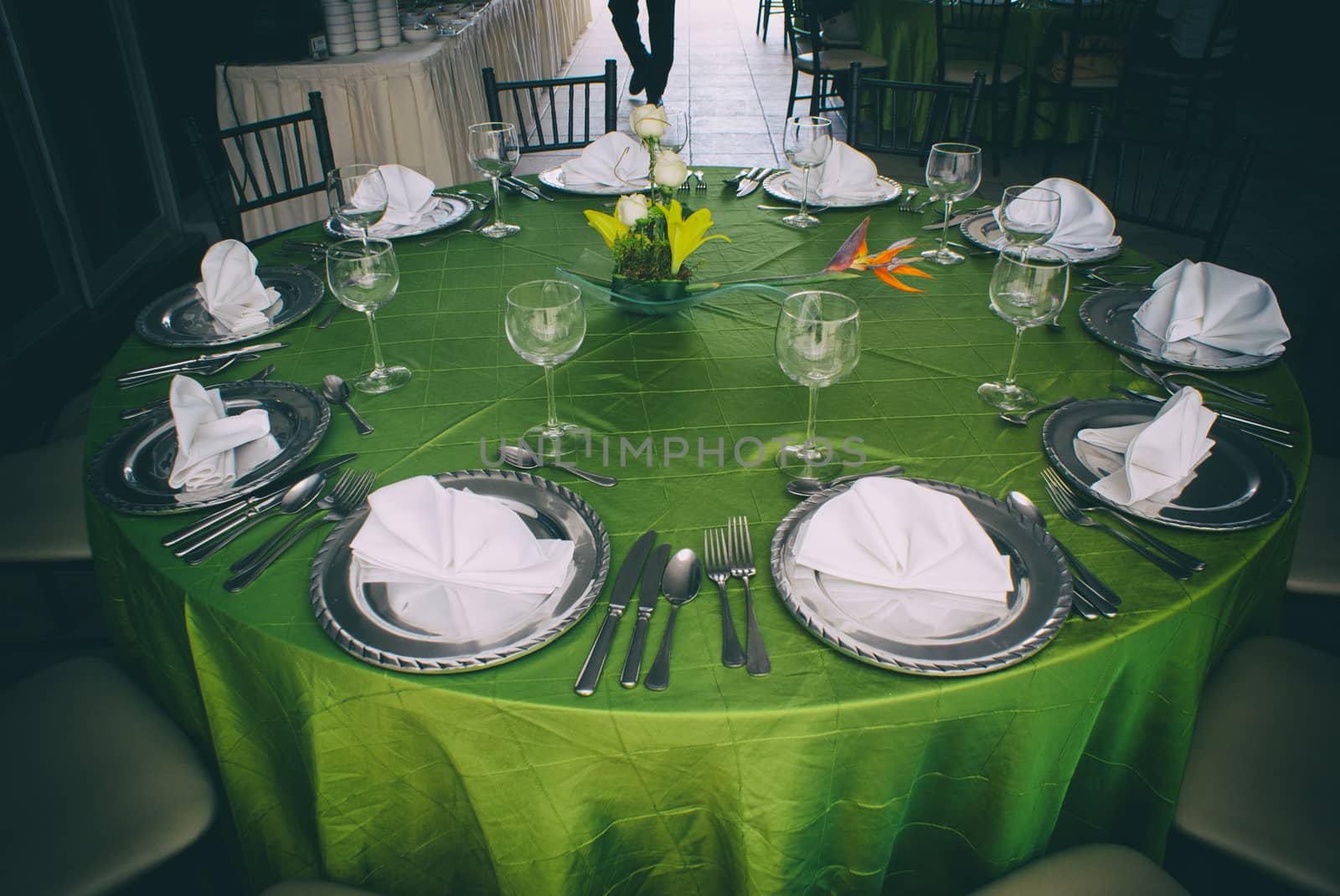 Photograph of an elegant table with silver clutery and wineglasses