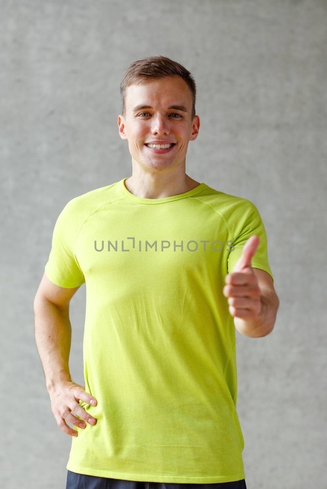 smiling man in gym by dolgachov