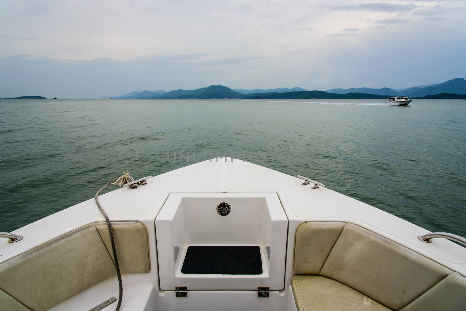 boat in water heading to coast