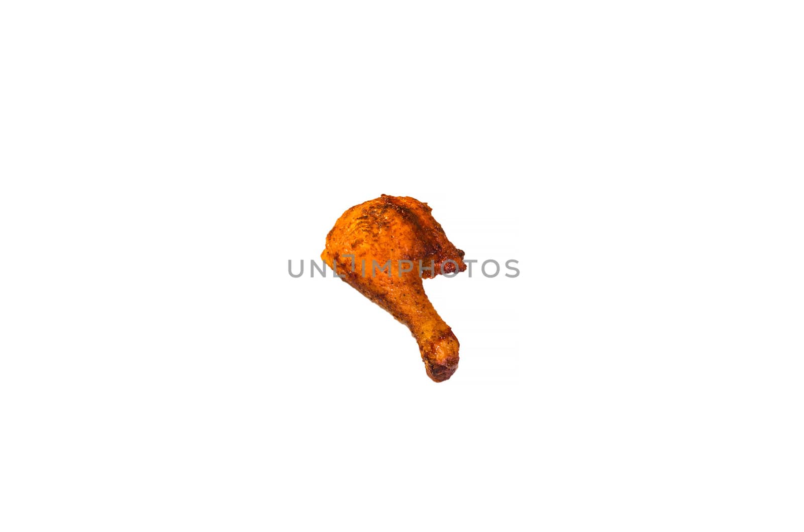 Close up of a fried chicken leg against white background.