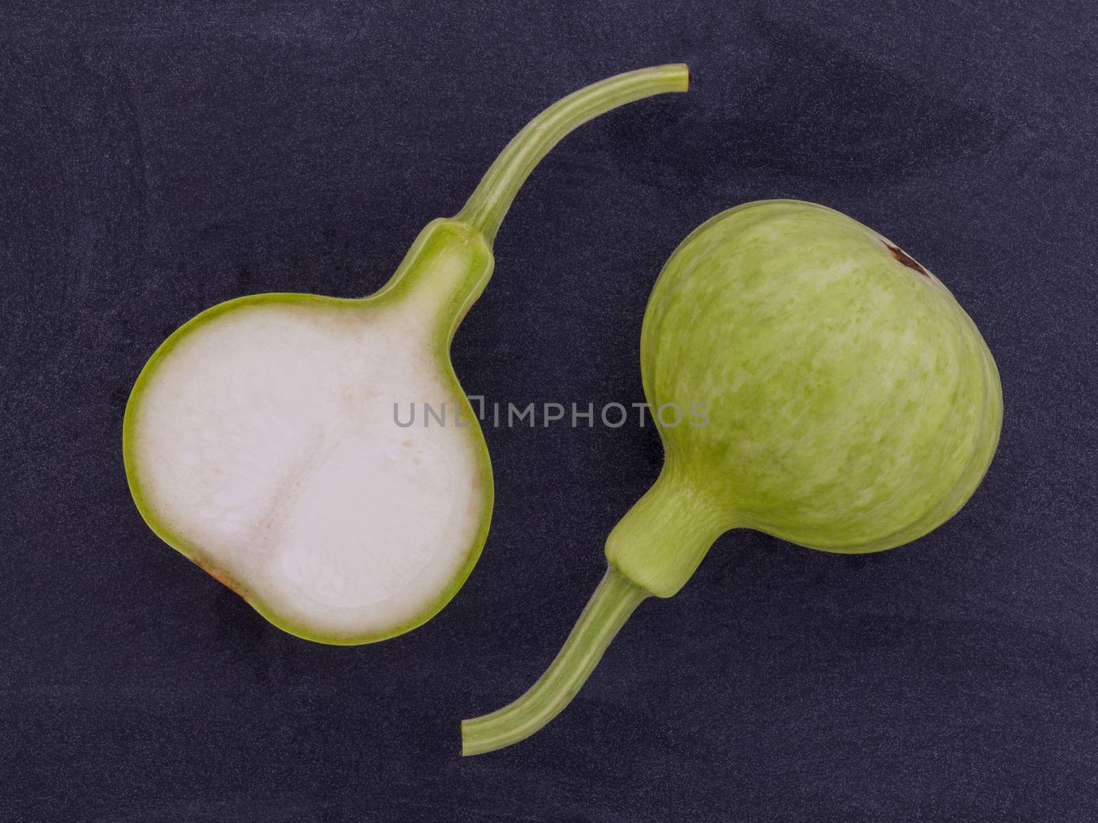 Halved bottle gourd,calabash gourd ,flowered gourd on wooden