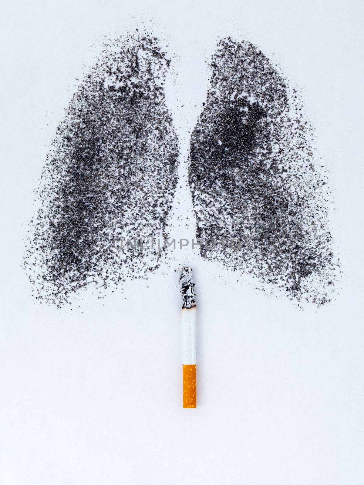 Shape of lungs with charcoal powder and cigarette on white backg by kerdkanno